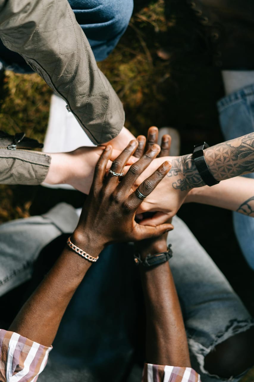Group of People Putting Their Hands Together