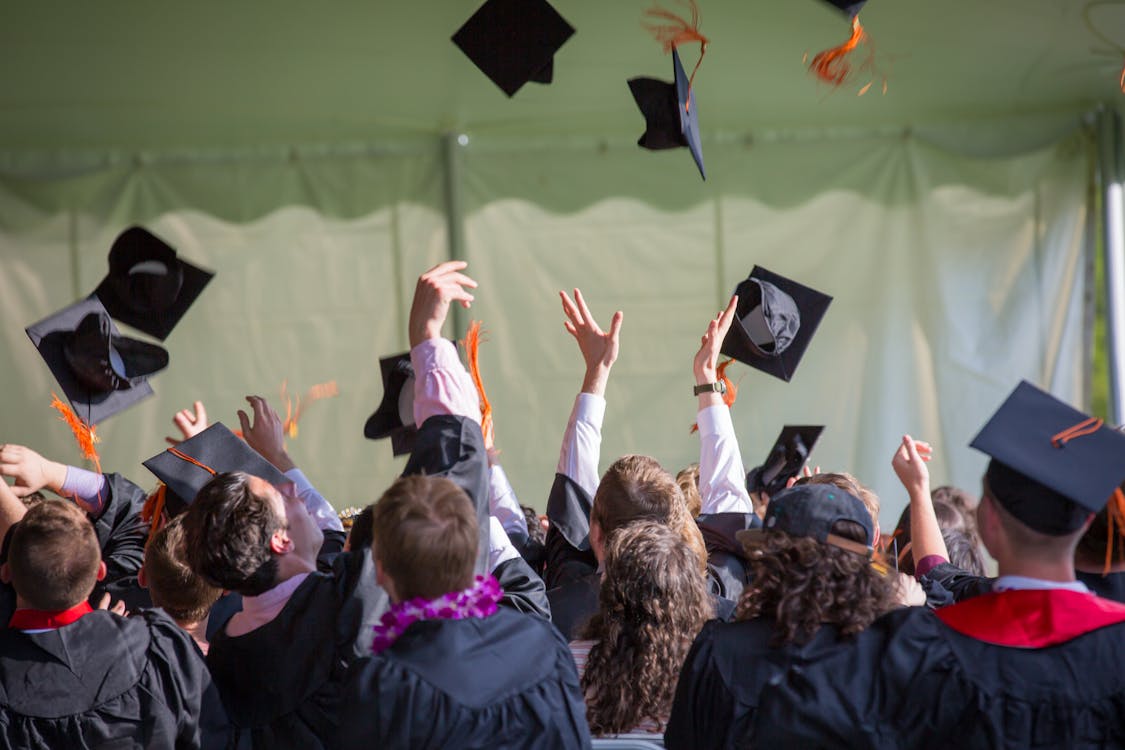 Graduates tossing caps