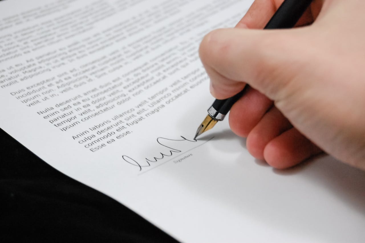 Person Signing Documentation Paper